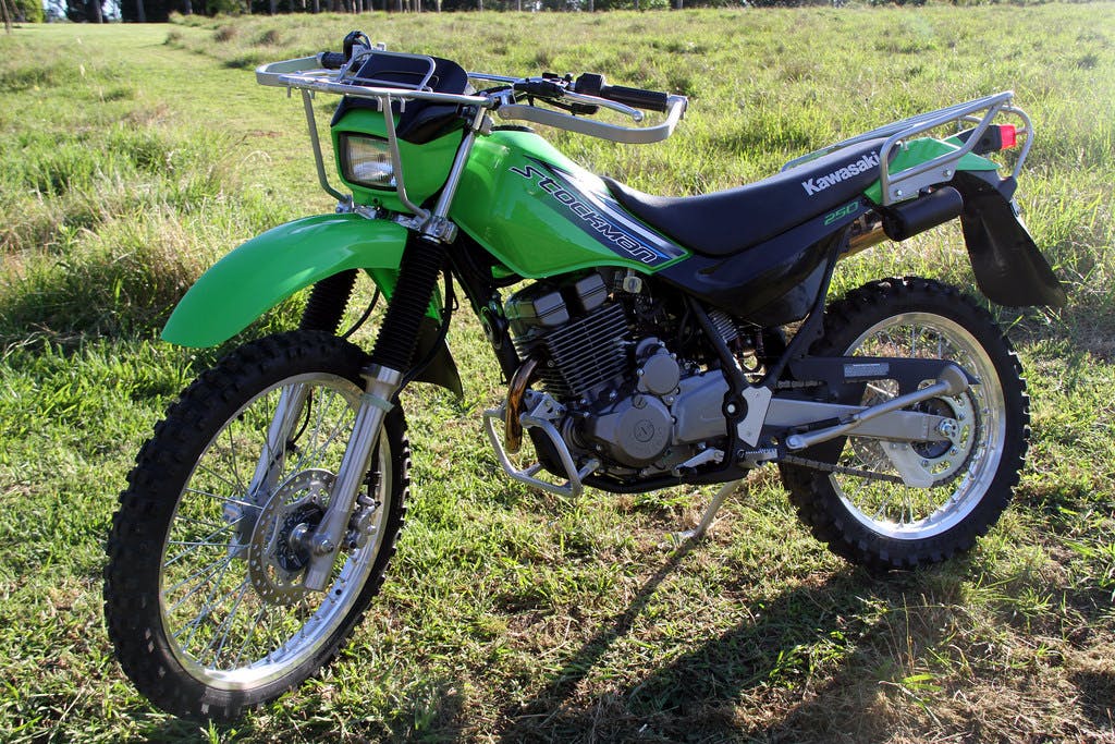 KAWASAKI STOCKMAN 250 parked in a farm