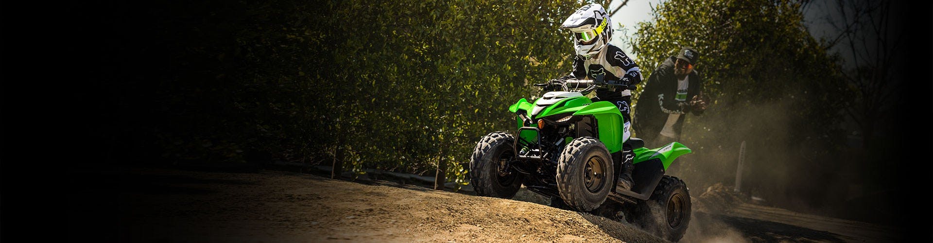 Kawasaki KFX90 in lime green colour on off road track