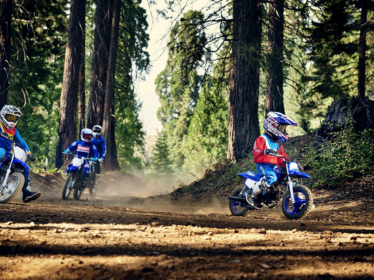 Yamaha PW50 in Team Yamah Blue And white colour, being ridden off-track