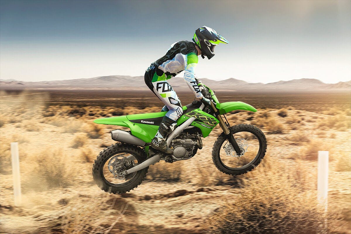 Kawasaki KX450XC in lime green colour on off road track
