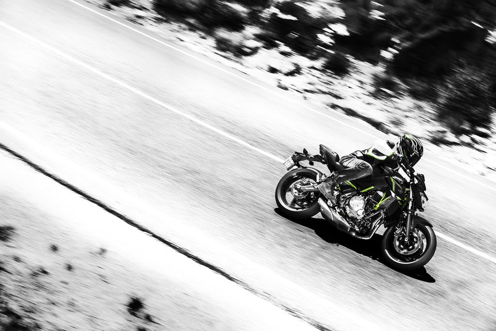 KAWASAKI Z650L being ridden on a road