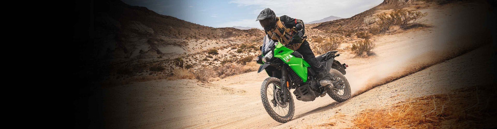 Kawasaki KLR650 in candy lime green colour on off road track