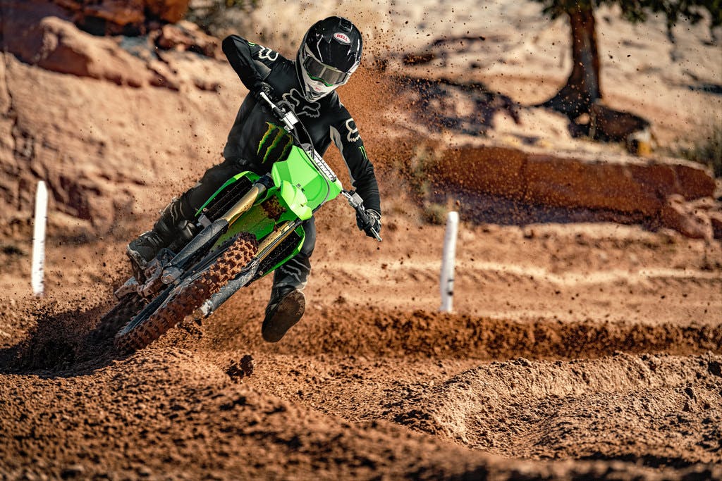 KawasakiI KX250 in lime green colour on off-road track