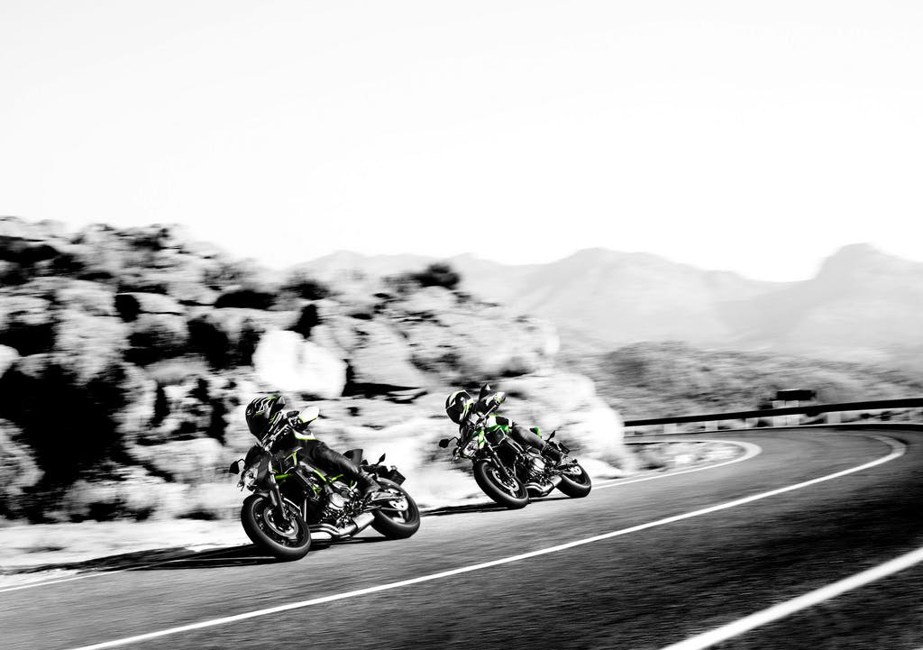 KAWASAKI Z650L being ridden on a hill road