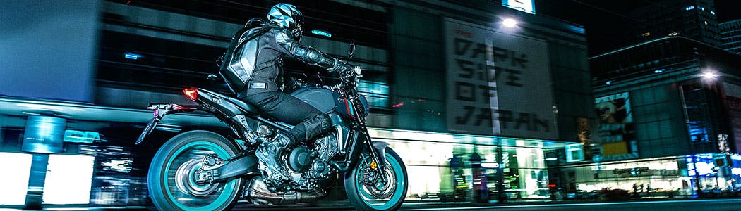 Yamaha MT-09 in cyan storm colour on the road.