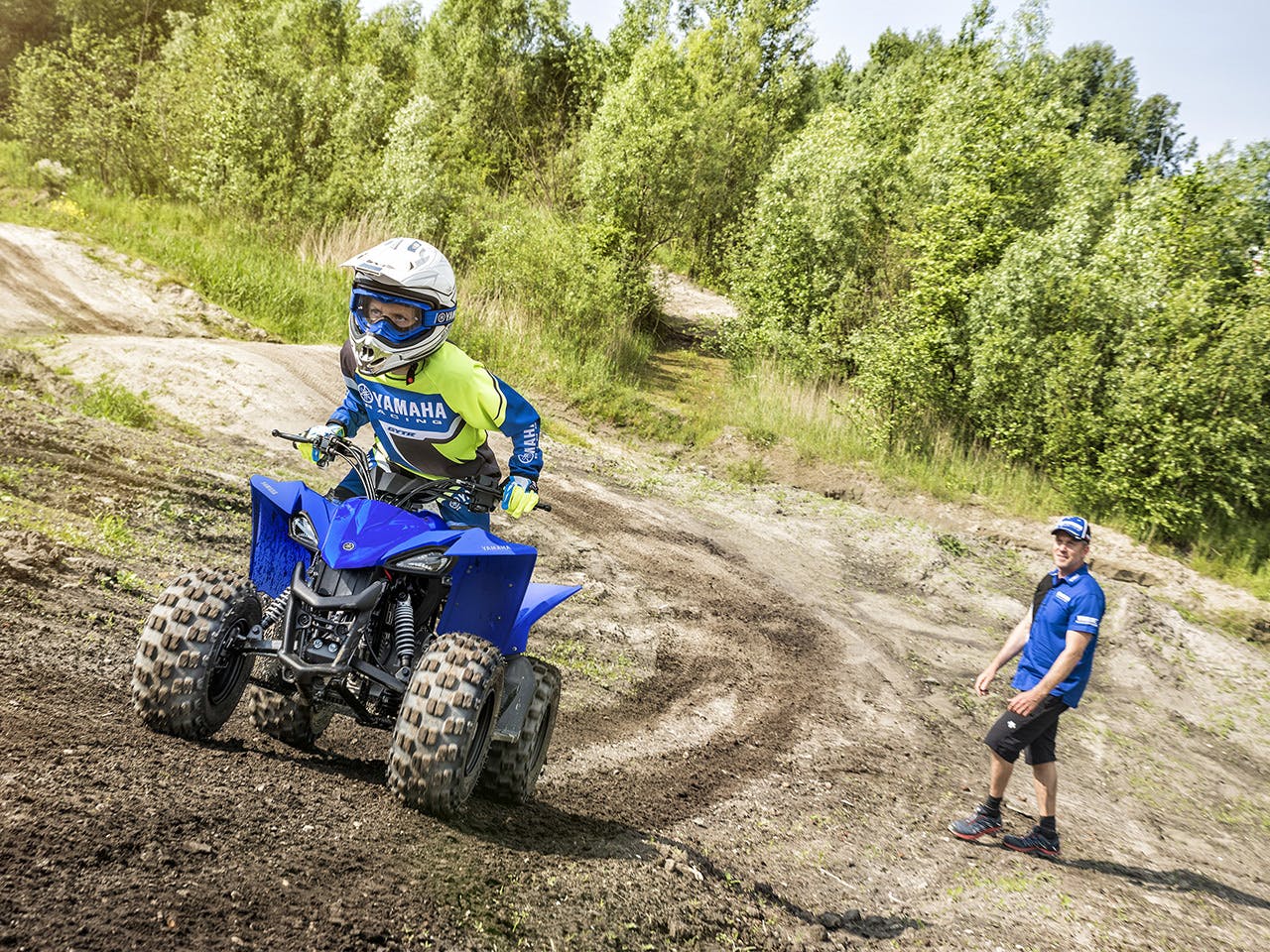 Yamaha YFZ50 in team yamaha blue colour, being ridden off-track