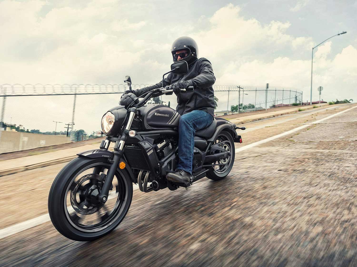 KAWASAKI VULCAN S CAFE being ridden on a road