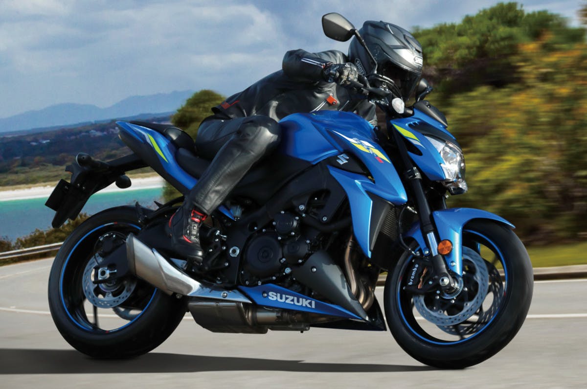 SUZUKI GSX-S1000 being ridden on a road