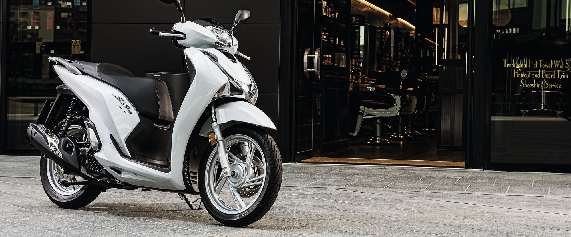 Honda SH150 pearl jasmine white colour, parked