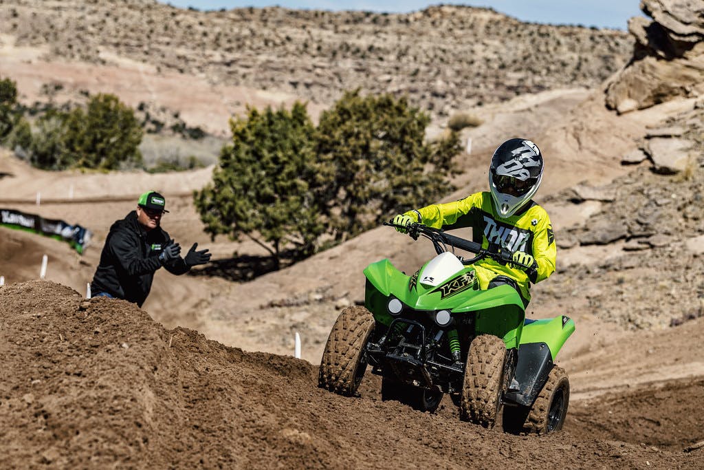 Kawasaki KFX90 in Lime Green colour in action on dirt track