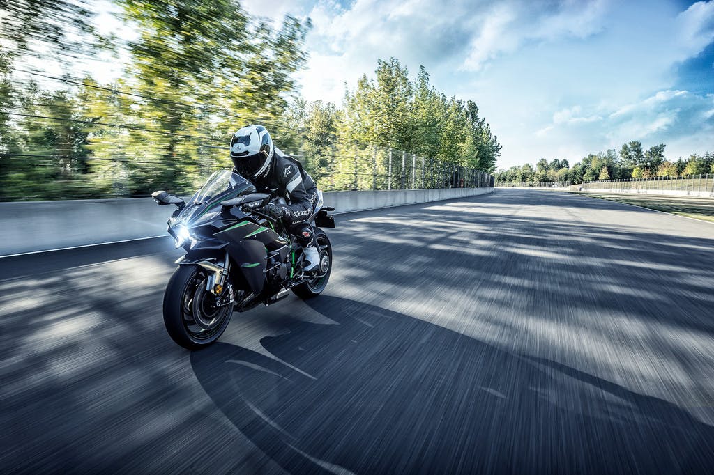 KAWASAKI NINJA H2 CARBON being ridden on a road