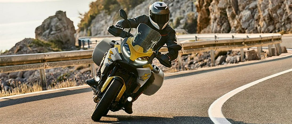 BMW F 900 XR in Exclusive Style - Galvanic Gold Metallic colour in action on the road.