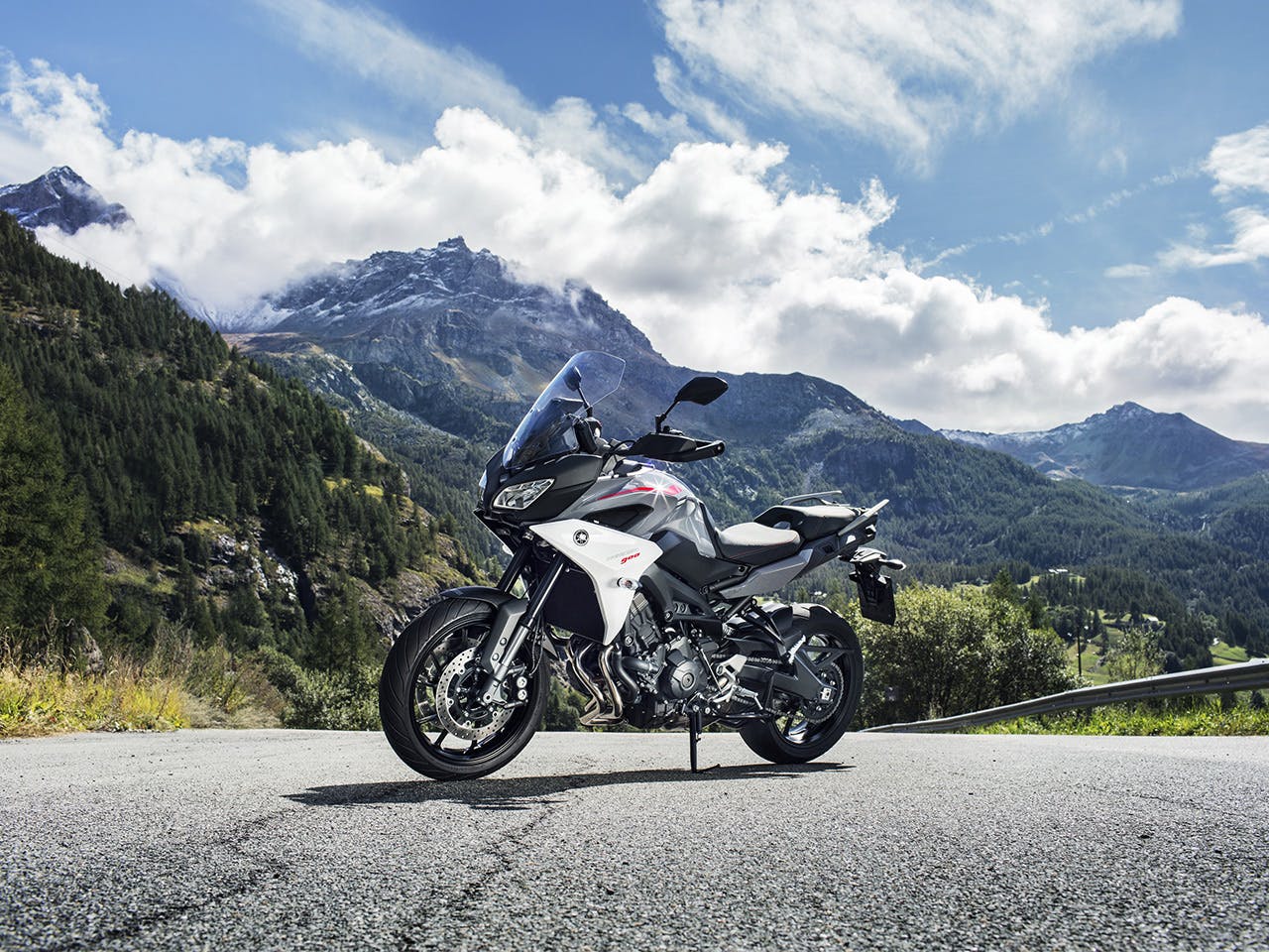 Yamaha Tracer 900 motorcycle parked on the hill road