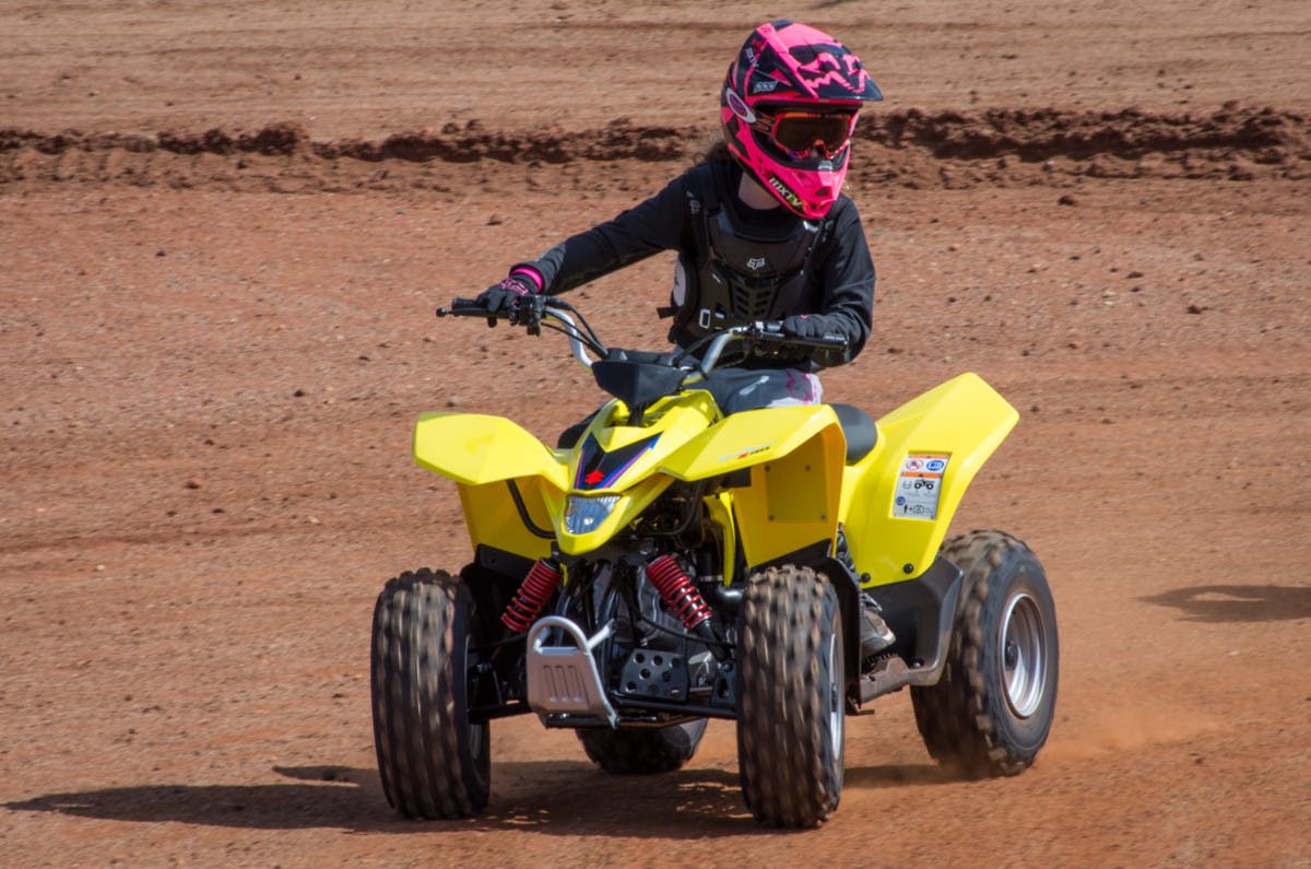 SUZUKI QUADSPORT Z90 being ridden off road