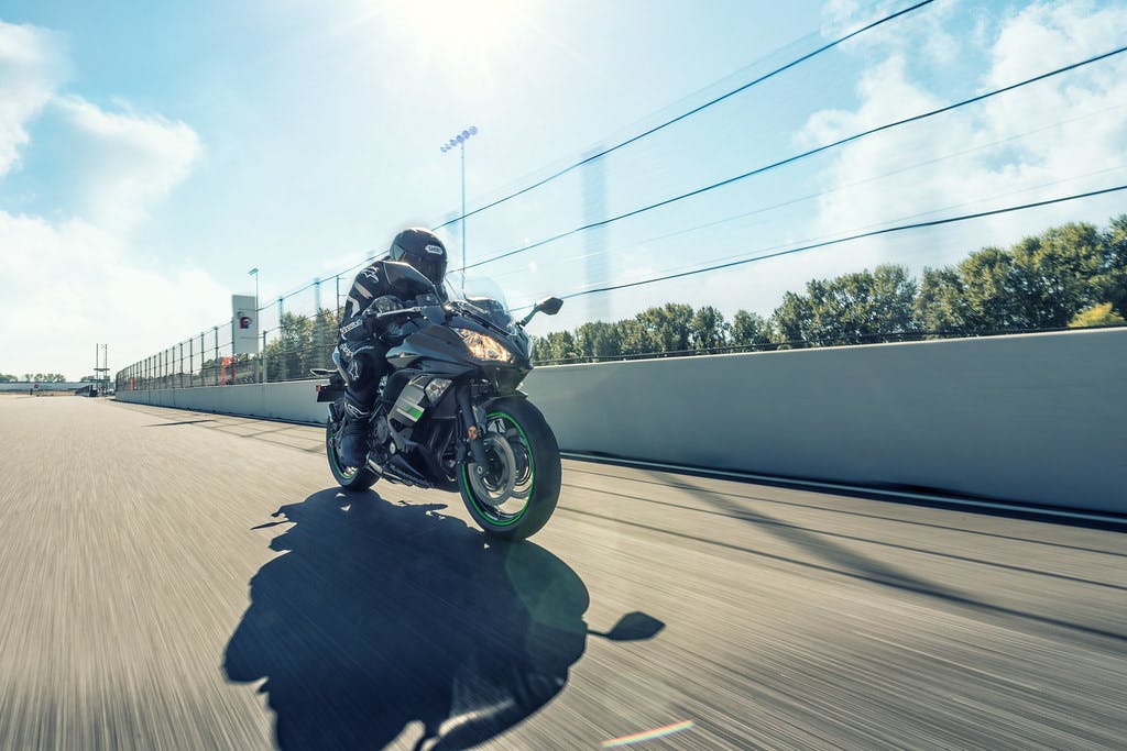 KAWASAKI NINJA 650L in metallic spark black colour, being ridden on a road