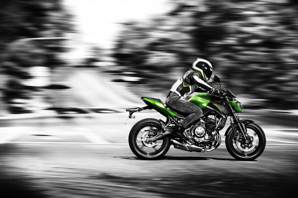 KAWASAKI Z650L being ridden on a road