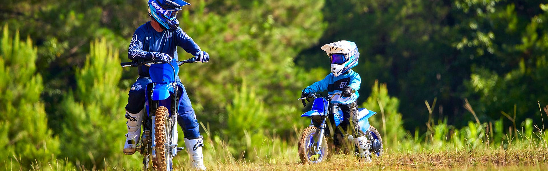 Yamaha PW50 in team yamaha blue colour, being ridden off-track
