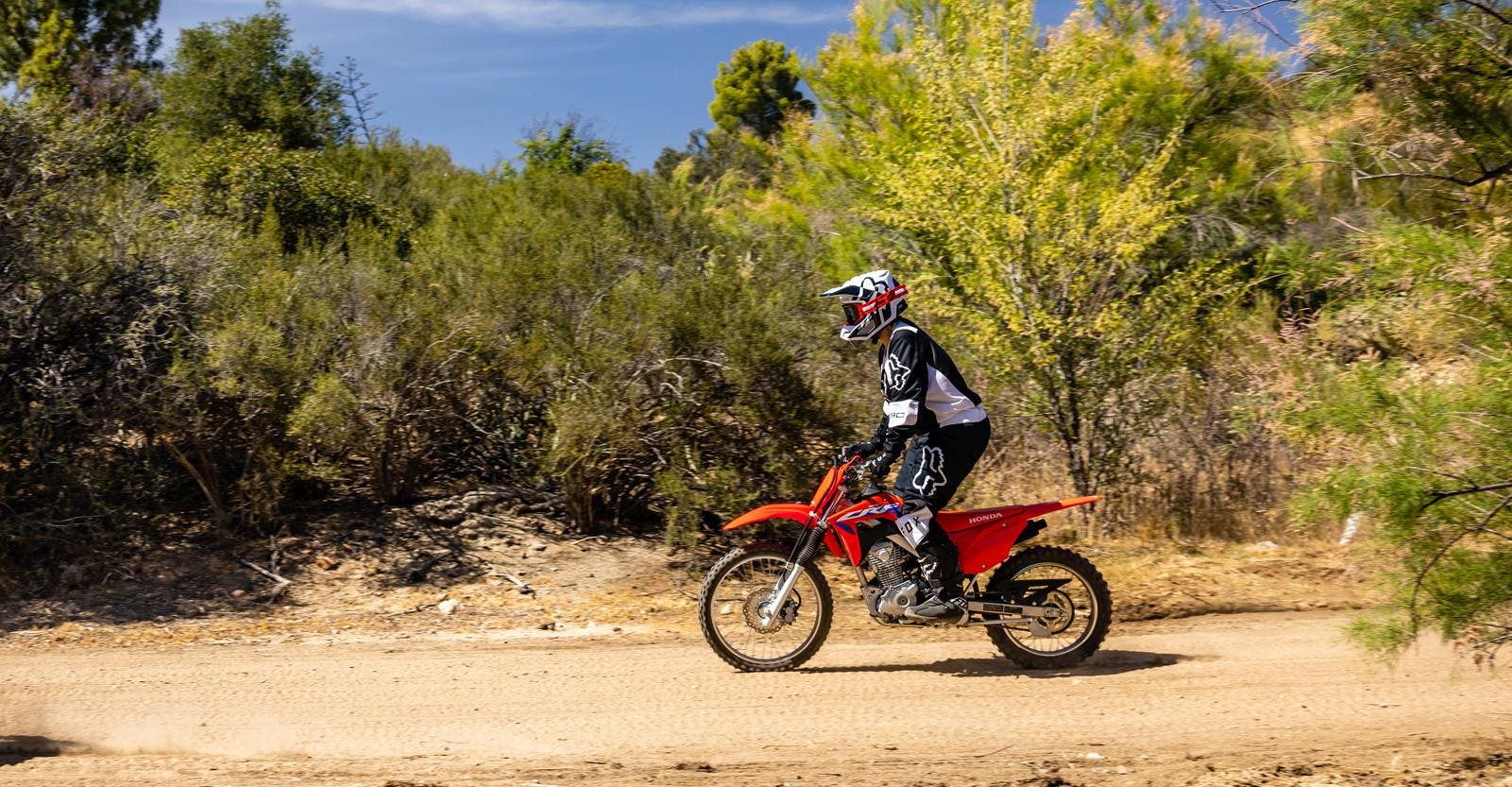 Honda CRF125FB in extreme red colour on off road track