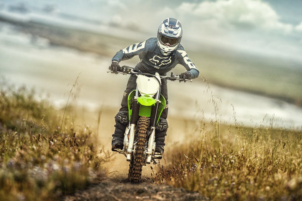 Kawasaki KLX230R in Lime Green colour on off road track