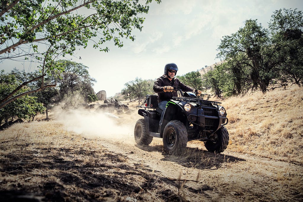 KAWASAKI Brute Force 300 in Super Black colour on dirt track