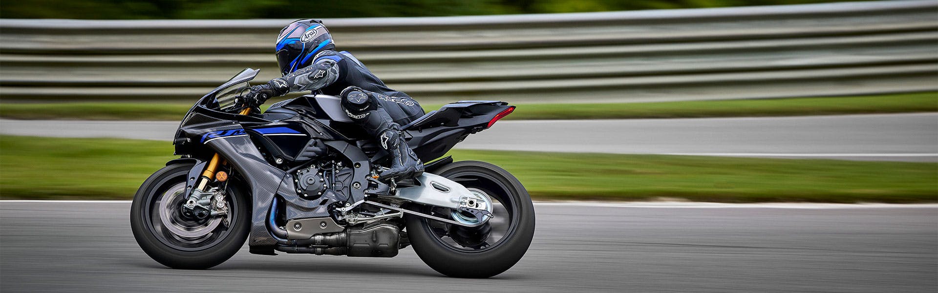 Yamaha YZF-R1M in Icon Performance colour in action on the road.