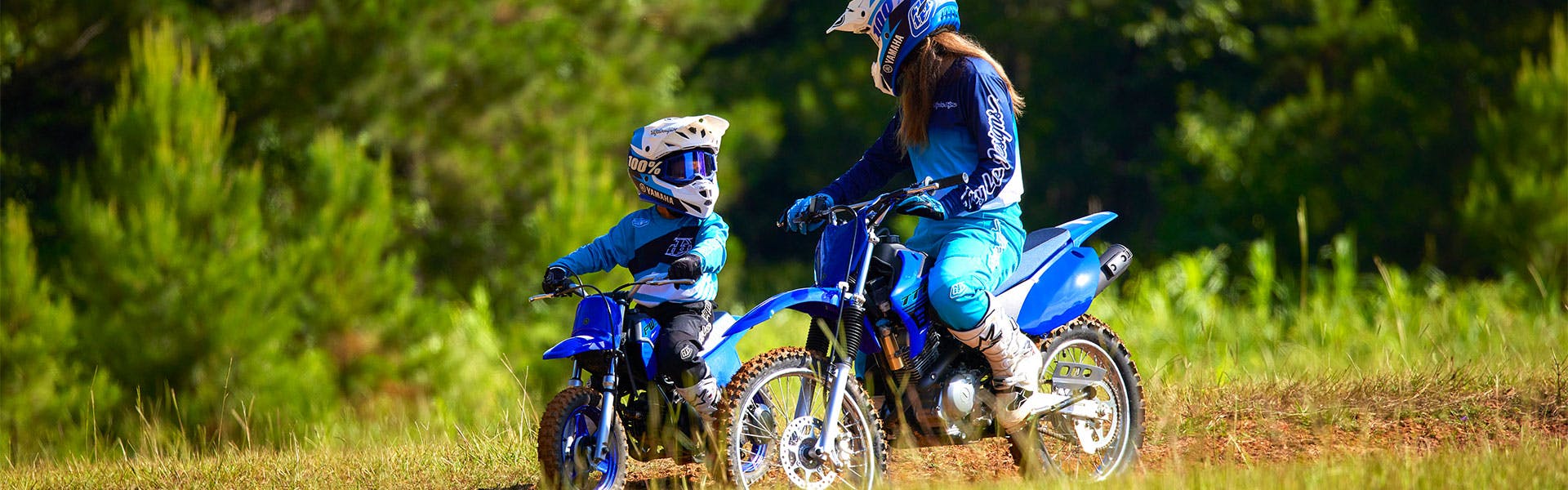 Yamaha PW50 in team yamaha blue colour, being ridden off-track