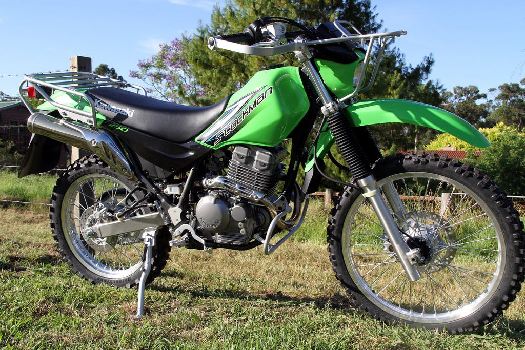 KAWASAKI STOCKMAN 250 parked in a farm