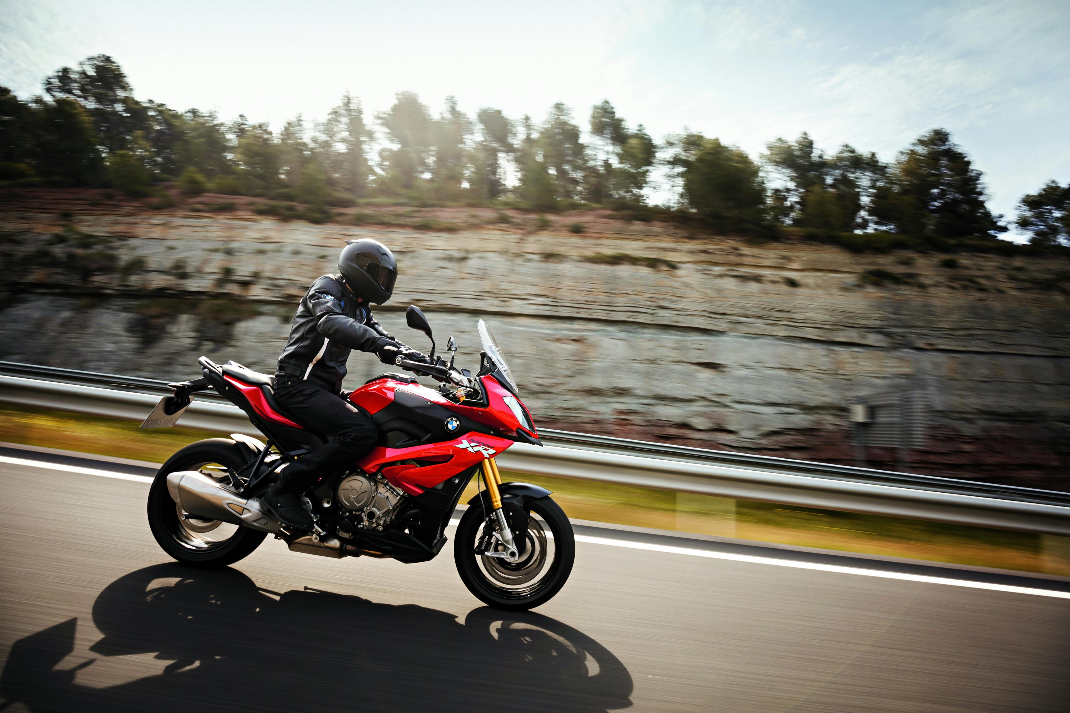 BMW S 1000 XR being ridden on the hill road