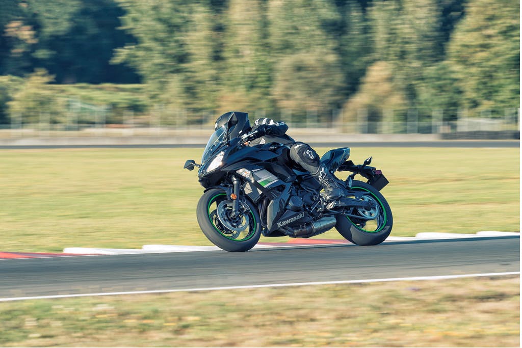 KAWASAKI NINJA 650L in metallic spark black colour being driven in a race track
