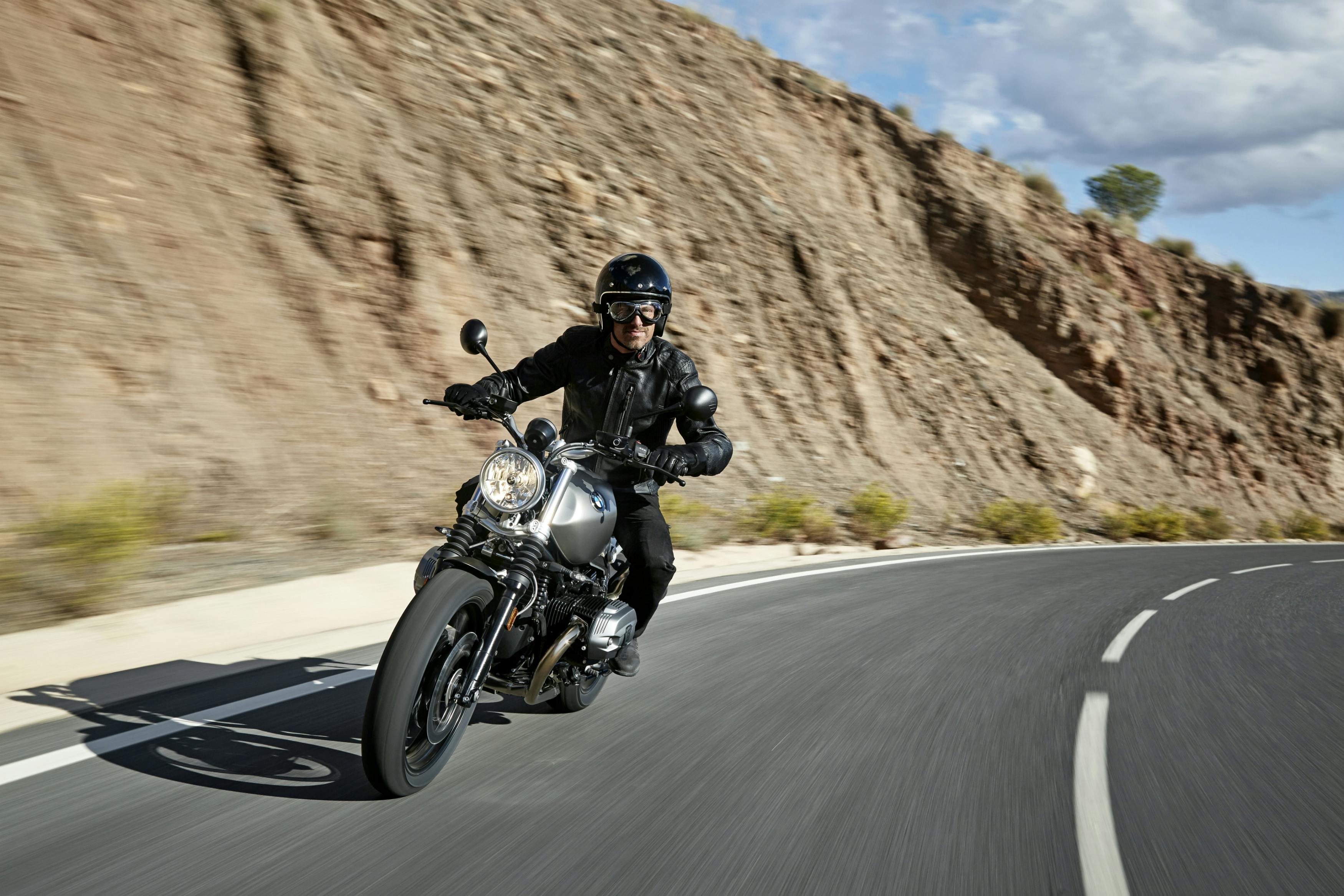 BMW R NINET SCRAMBLER SPEZIAL being ridden on the hill road
