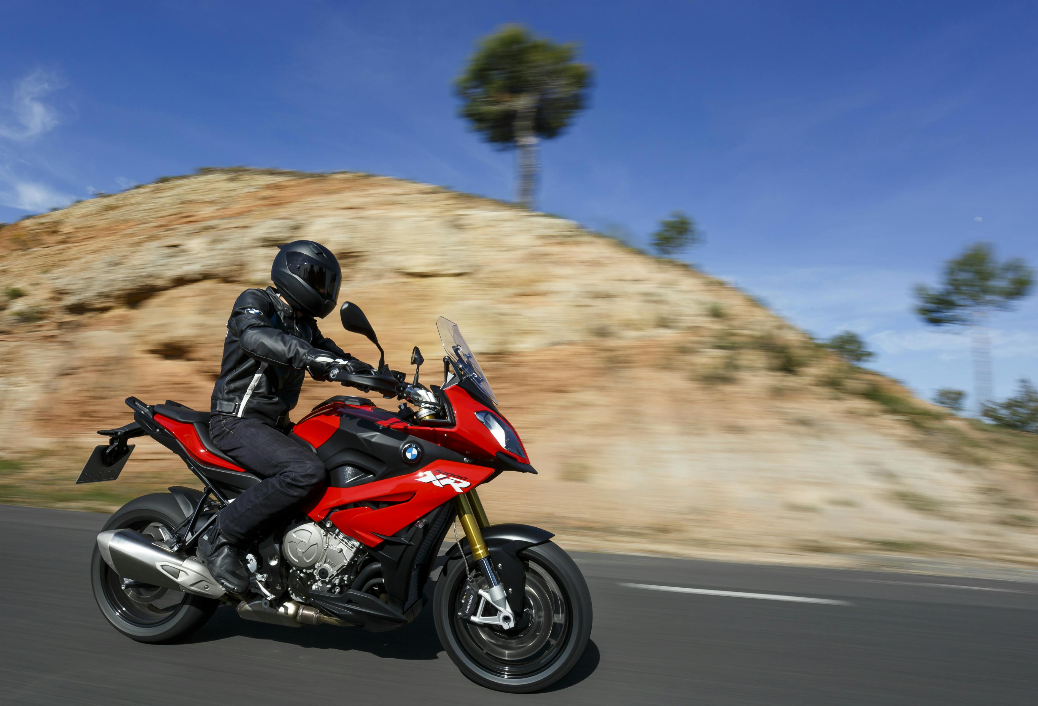 BMW S 1000 XR being ridden on the hill road
