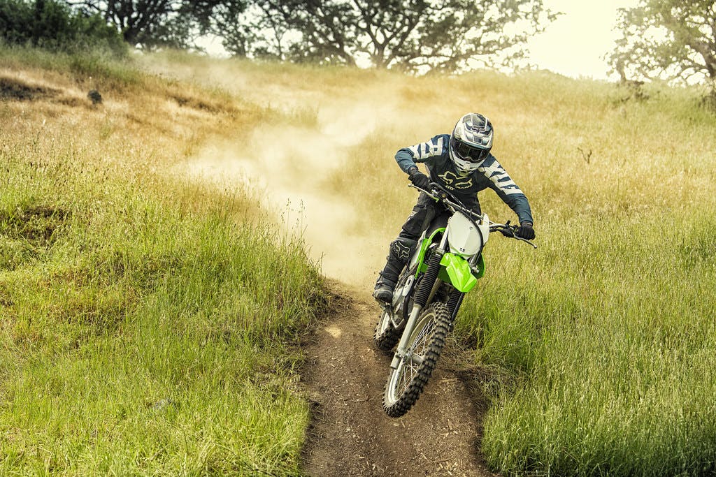 Kawasaki KLX230R in Lime Green colour, off road track