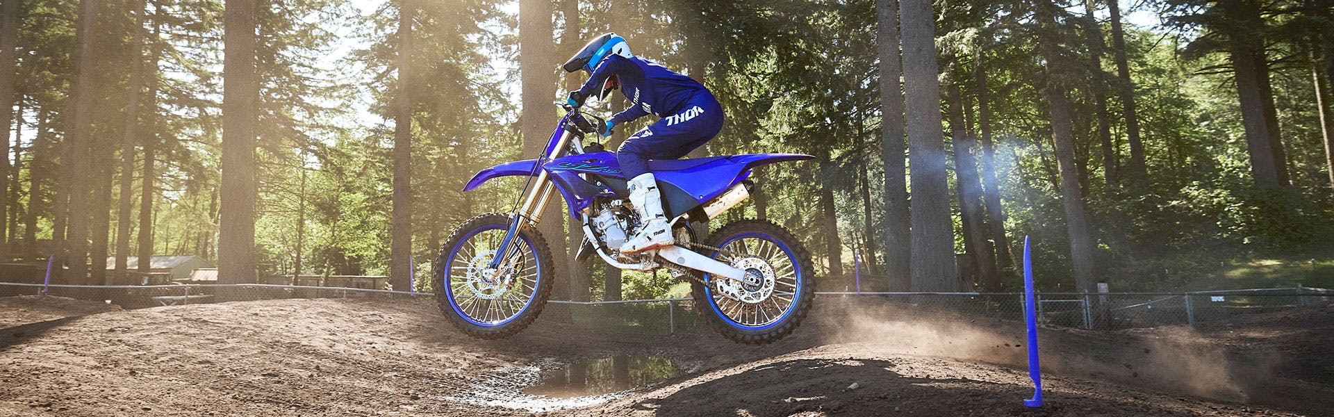 Yamaha YZ125 in team yamaha blue colour being ridden in off road track