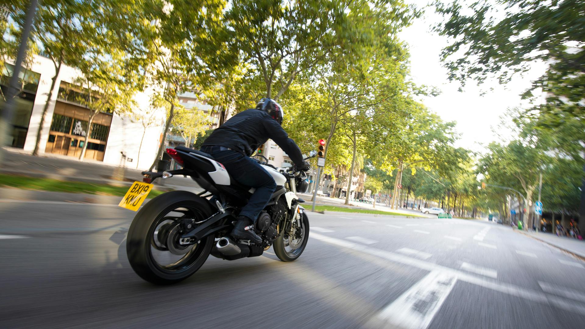 Triumph Street Triple S in crystal white colour on the road