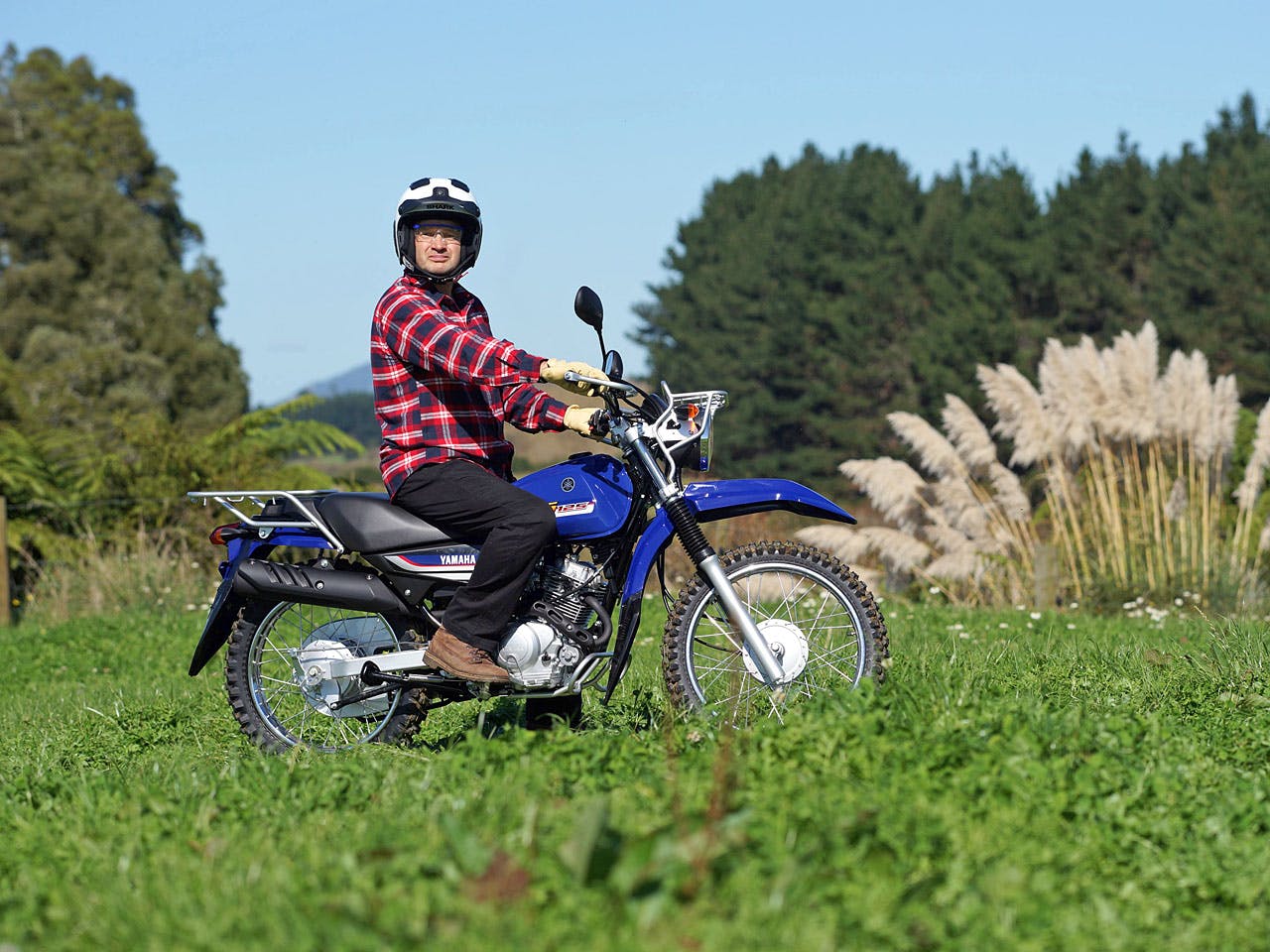 Yamaha AG125 motorcycle on a farm