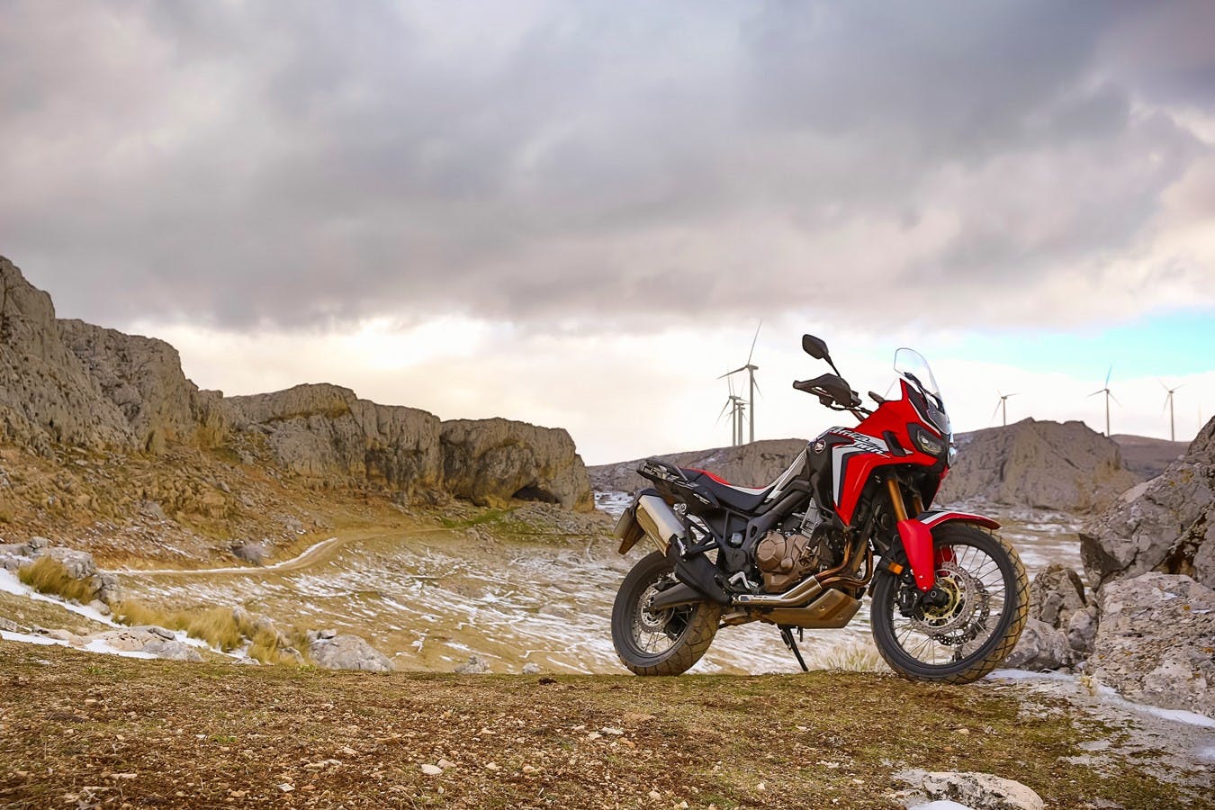 Honda 2018 africa twin in grand prix red colour, parked on a hill