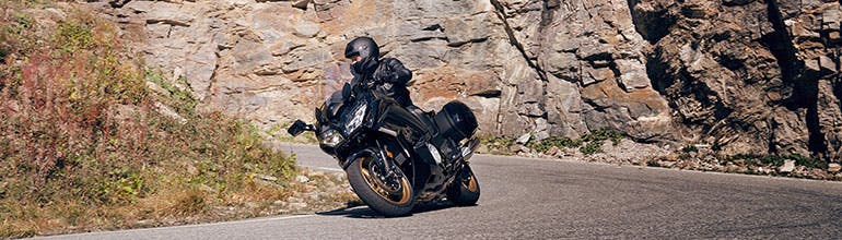 Yamaha FJR1300AE in midnight black colour on the road