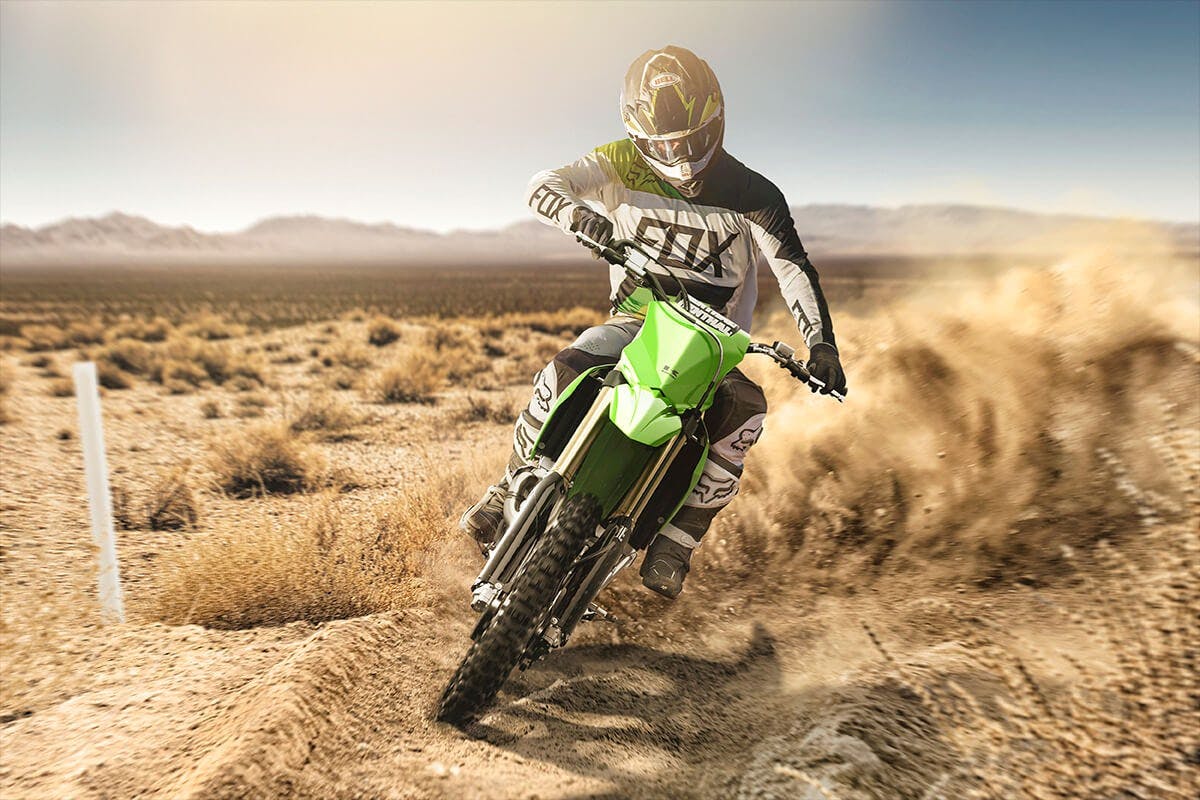 Kawasaki KX450XC in lime green colour on off road track