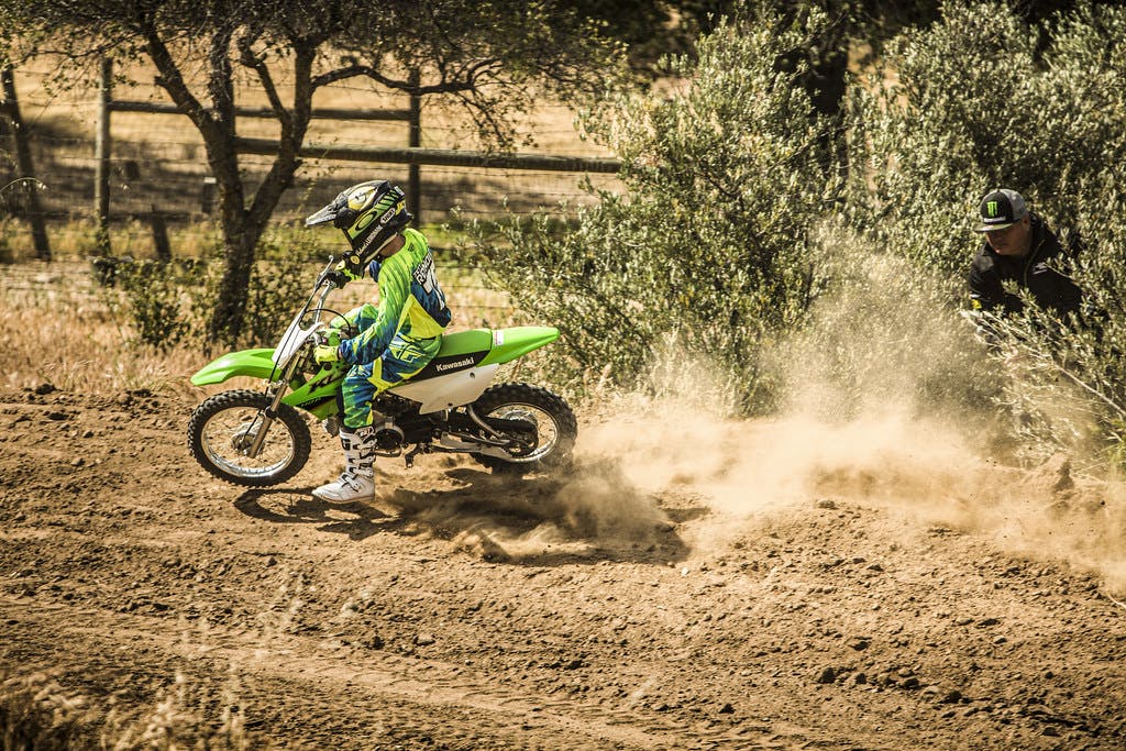 Kawasaki KLX110R in Lime Green colour on track