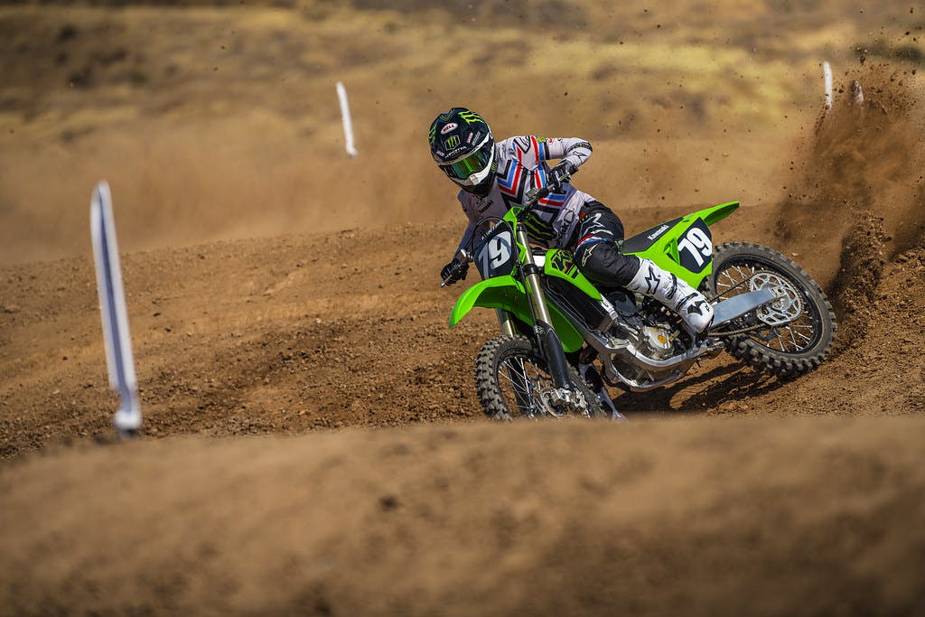 KawasakiI KX250 in lime green colour on off-road track