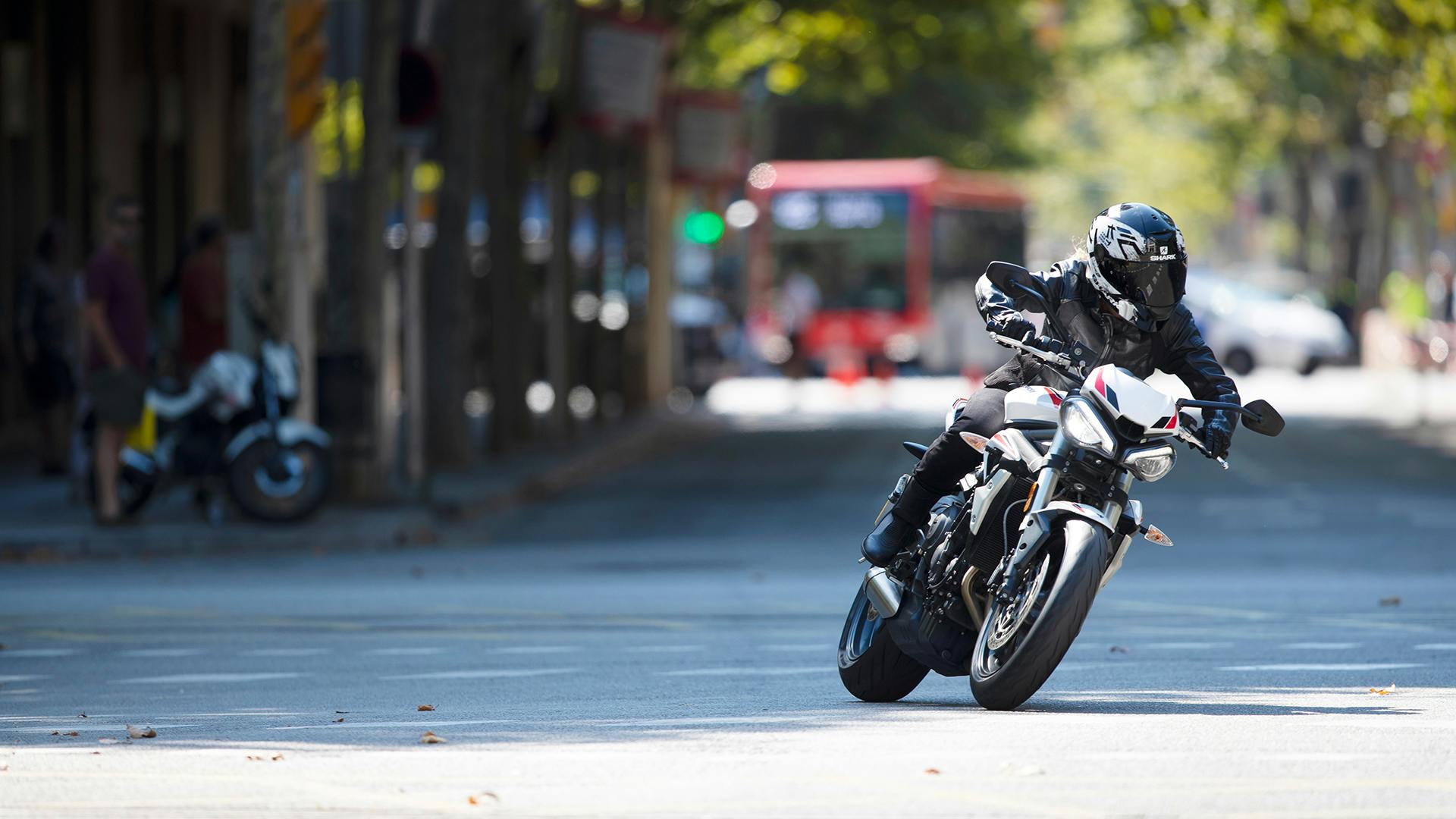 Triumph Street Triple S in crystal white colour on the road