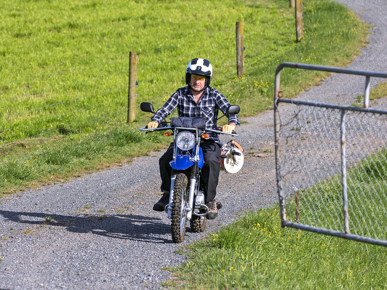 Yamaha AG125 motorcycle on a farm