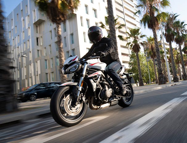 Triumph Street Triple S in crystal white colour on the road