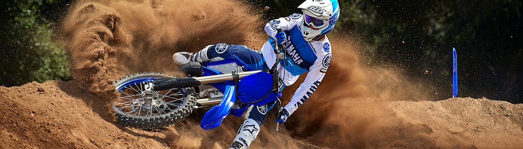 Yamaha YZ125 in team yamaha blue colour being ridden in off road track