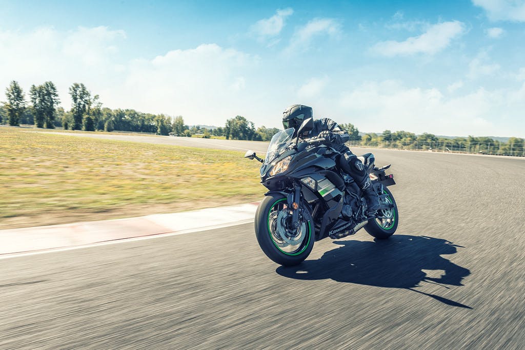 KAWASAKI NINJA 650L in metallic spark black colour, being ridden on a road