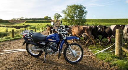 Yamaha AG125 motorcycle on a farm