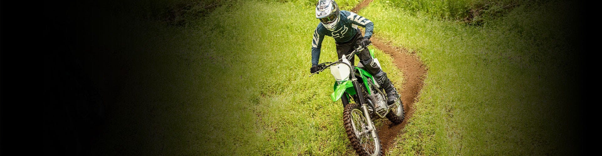 Kawasaki KLX230R S in Lime Green colour off track
