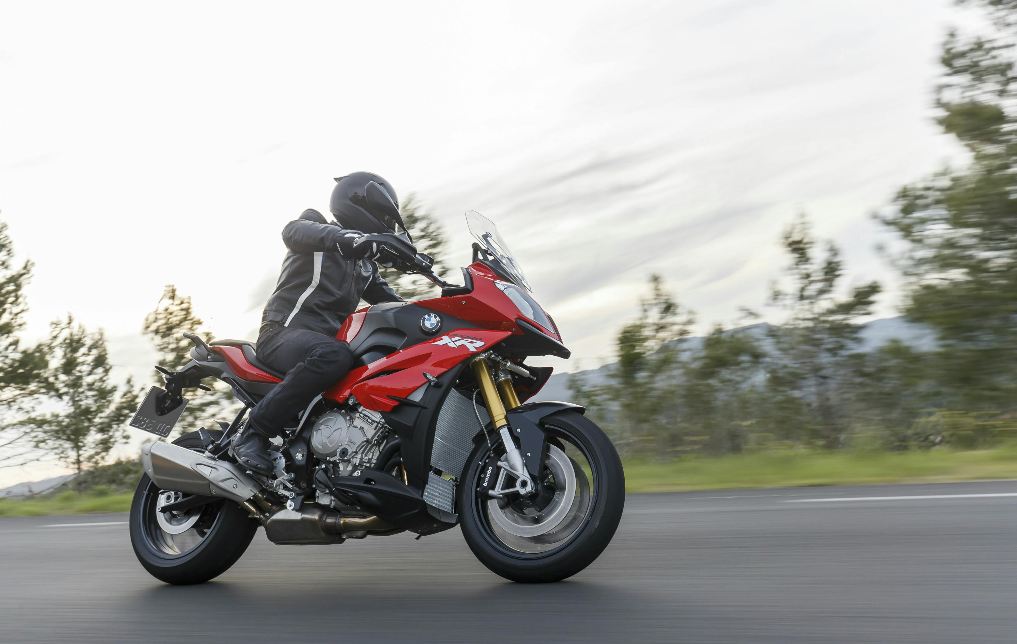 BMW S 1000 XR being ridden on the hill road