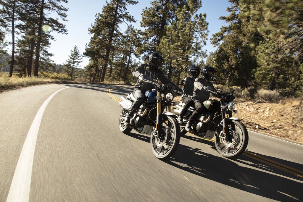 TRIUMPH SCRAMBLER 1200XC being ridden on the hil road
