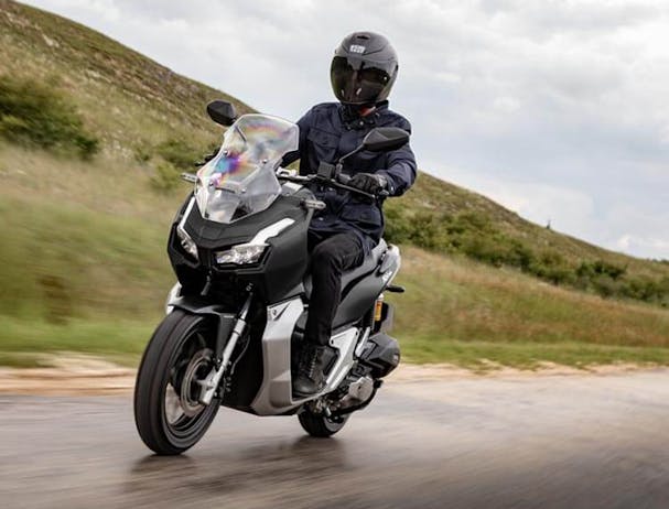 Honda ADV150 in Matte Black Metallic colour on the road